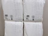 four bags of toilet paper stacked on top of each other