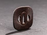 a close up of a small metal object on a table