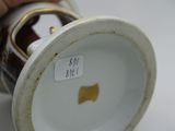 a close up of a person holding a cup with a sticker on it