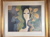 painting of a woman in a gold frame on a wall