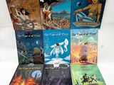 six children ' s books are lined up on a white surface