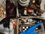 a cardboard box filled with assorted items on the floor