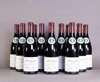 six bottles of wine are lined up on a table
