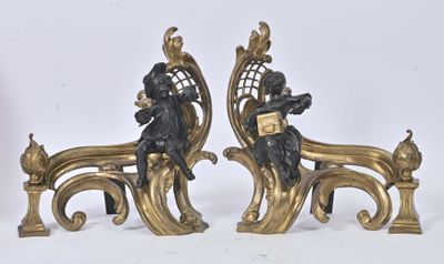 a pair of statues that are sitting on a bench