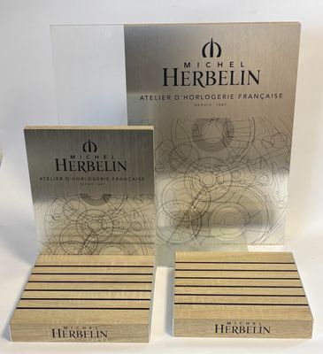 a set of three wooden coasters with a logo on them
