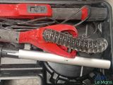 a tool in a toolbox with a wrench and a wrench