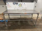 a table with a map on it in a garage