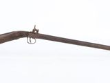 an old rifle with a wooden barrel on a white background