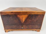 an old wooden box with two drawers on top of it