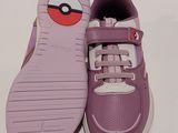 purple and white sneakers with a pokemon face on the sole