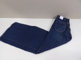 a pair of jeans sitting on top of a white table