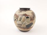 a vase with a painting of horses on it