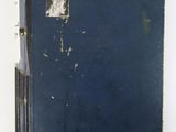 an old blue book with a picture of a woman on it