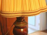 a lamp that is sitting on a table with a pair of scissors