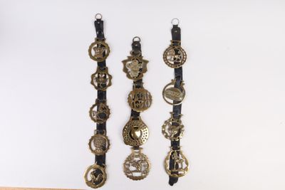 five different types of bracelets hanging on a wall