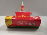 a red toy boat that is on a white table
