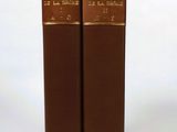 two books that are sitting on a white surface
