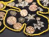many different types of brooches on a table