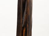 sculpture of a piece of wood on a white pedestal
