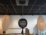 three lamps hanging from the ceiling above a table