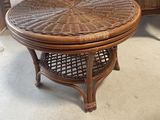 a wicker coffee table with a wicker top