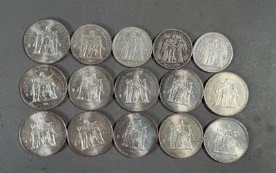six quarters of silver coins are arranged in a row on a gray surface