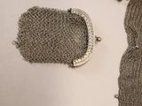 a chain mail bag and a chain mail bag on a table