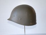 a helmet that is on a stand on a table