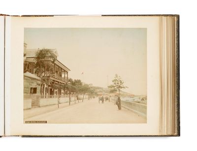 an old photo of a street with people walking down it
