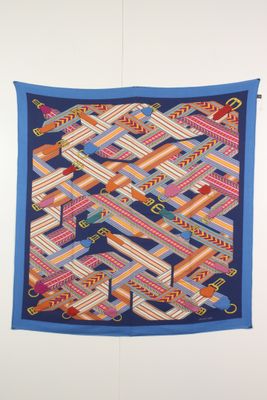 an image of a colorful quilt hanging on a wall