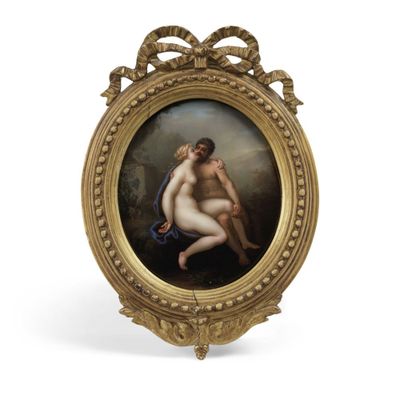 une image représentant un tableau de deux nus dans un cadre doré