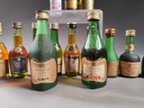 several bottles of liquor are lined up on a table