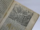 an old book with a drawing on it that is open