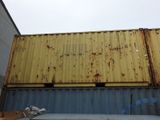 a large yellow container sitting on top of a building