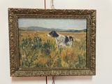 un tableau représentant un chien, accroché au mur