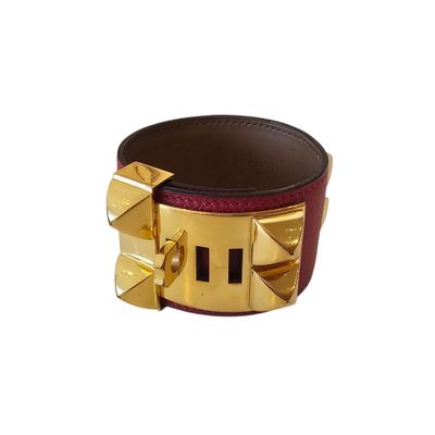 leather cuff bracelet with gold studs and a red leather band