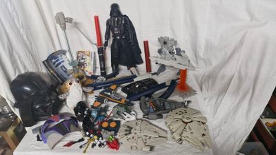 a lot of star wars action figures on a table
