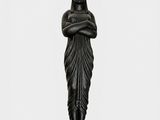 a black statue of a woman with a crown on her head