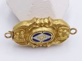 an image of a close up of a gold and blue broochle