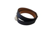 a close up of a black leather bracelet on a white background