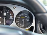 a close up of a car dashboard with a speedometer and gauges