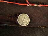 a coin sitting on top of a piece of cloth