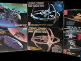 several star trek books are stacked on top of each other