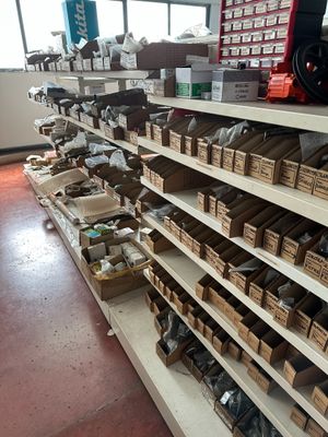 many boxes of assorted items on the shelves in the store
