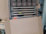 a cardboard box that is sitting on the floor next to a machine