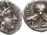 a close up of a silver coin with a man on it