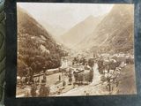 an old photo of a small town in the mountains