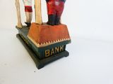 a statue of a man standing on top of a bank