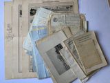 several old papers are stacked on top of each other on a table