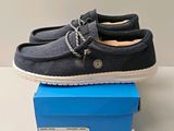 a pair of shoes that are on top of a box